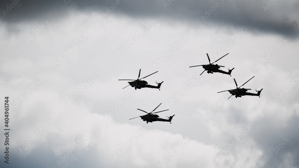 Helicopters fly under the clouds Helicopters fly under the clouds
