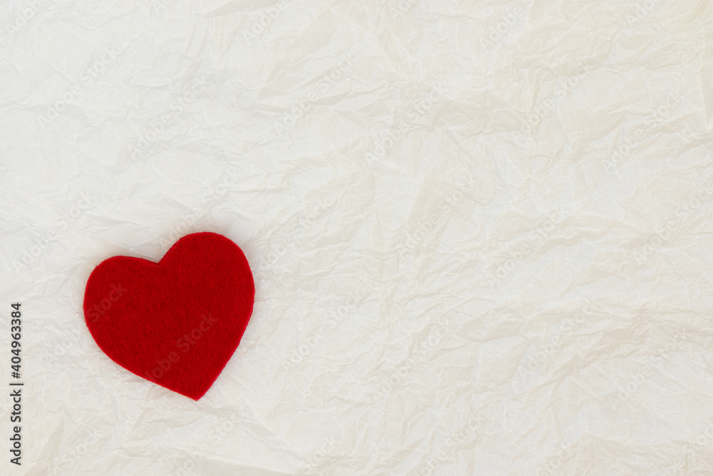 Red decorative heart on white paper background. Red decorative heart on white paper background.