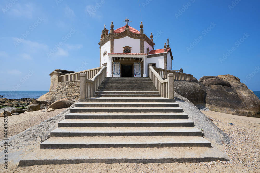Beautiful chapel on the beach Capela do Senhor da Pedra in Miramar, in Portugal