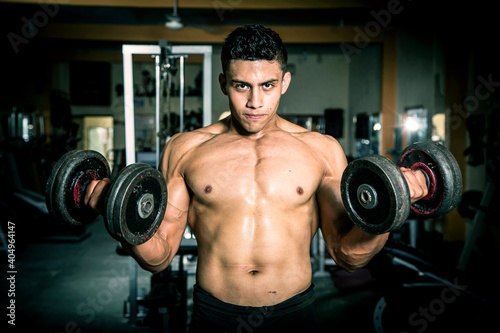 Young man exercising in dark and old gym © jcfotografo