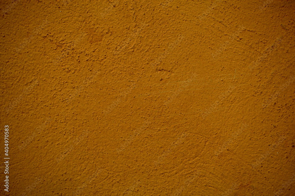 Background texture of the rough pitted surface of a painted brown wall in a full frame view. This is a lighter version, a darker version is also available in the portfolio Background texture of the rough pitted surface of a painted brown wall in a full frame view. This is a lighter version, a darker version is also available in the portfolio