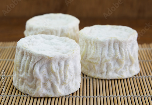 Crotten cheese with white mold lies on the table