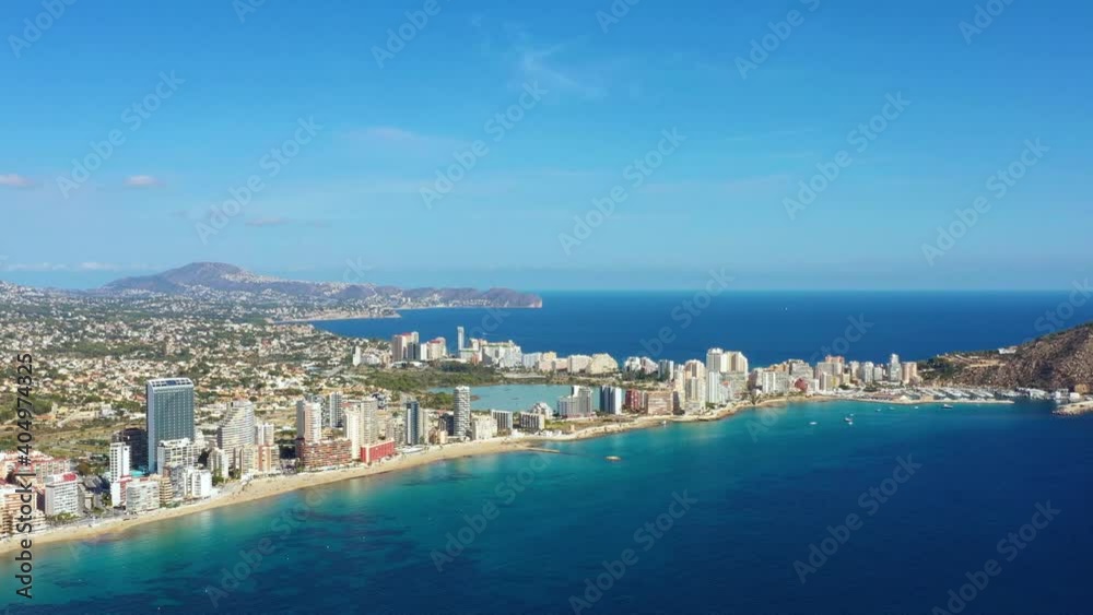 Aerial view with a drone of Penyal d'Ifac Natural Park near Calp city. Beautiful rock near buildings and a beach, perfect for tourism under the sun of Spain 4K Aerial view with a drone of Penyal d'Ifac Natural Park near Calp city. Beautiful rock near buildings and a beach, perfect for tourism under the sun of Spain 4K