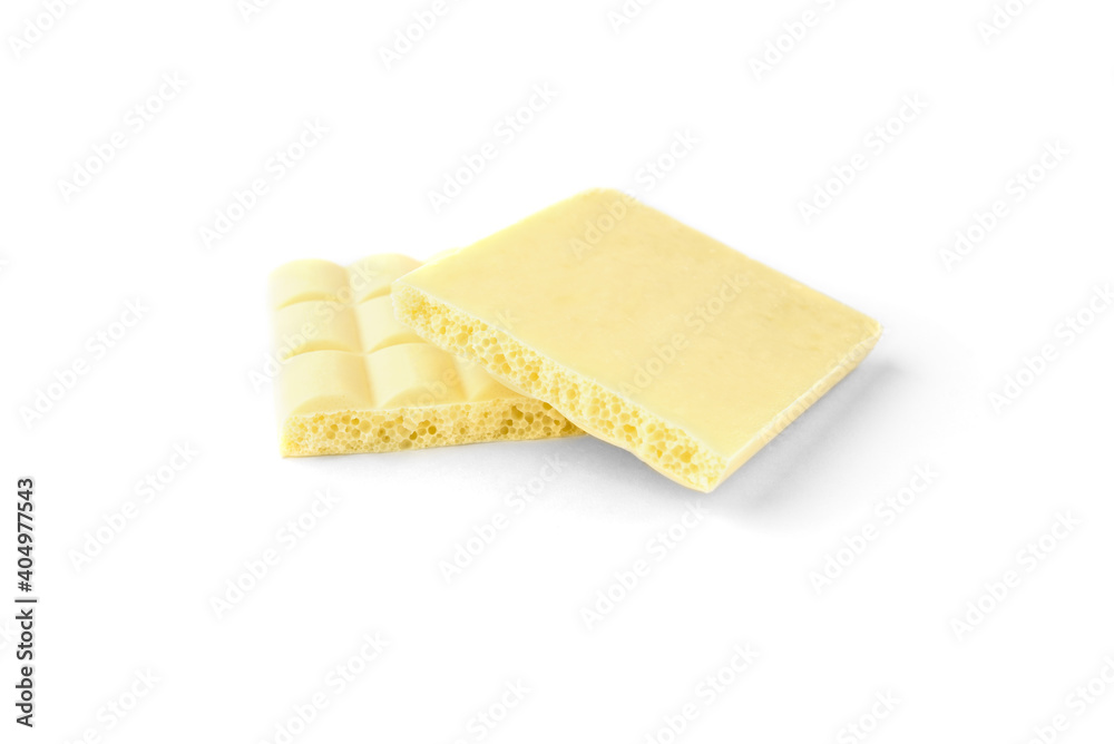 A white porous chocolate isolated on white background. A white porous chocolate isolated on white background.