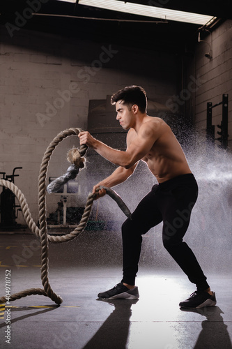 athletic young man doing functional training