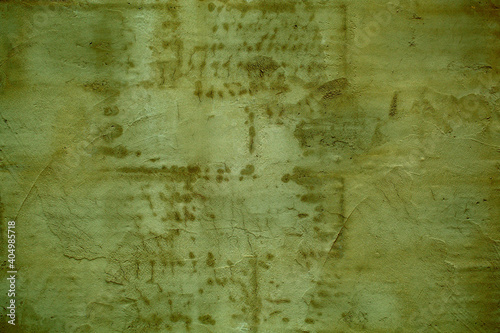 Dark dingy weathered wall background texture with stains and fine cracks in a full frame view. This is a lighter version, a darker version is also available in the portfolio