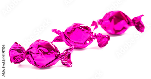 Three Pink Wrapped Candy on a White Background