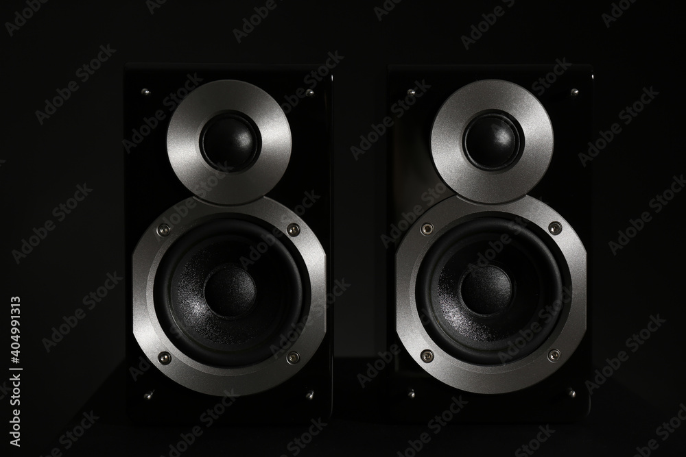 Modern powerful audio speakers on black background Modern powerful audio speakers on black background