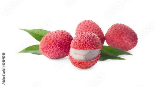 Fresh ripe lychees with green leaves on white background