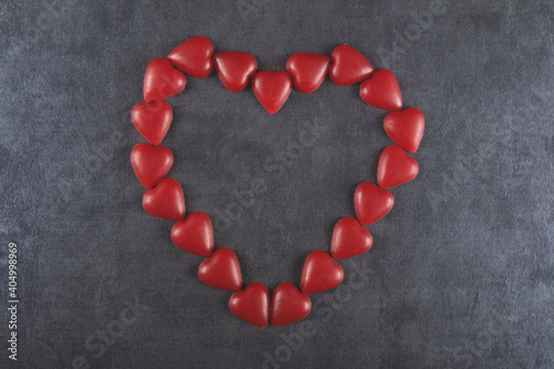 Valentine’s day background with red heart and gray background.