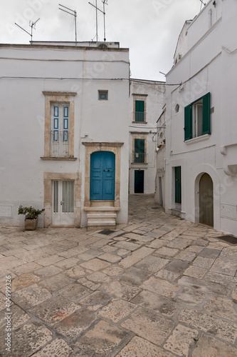 Typical Street Scene Of The Historical Center of Martina Franca, A Village In Puglia, Apulia, Italy On A Cloudy Rainy Day © Philippe