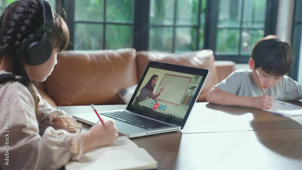 Homeschool Asian little young girl learning online class with teacher