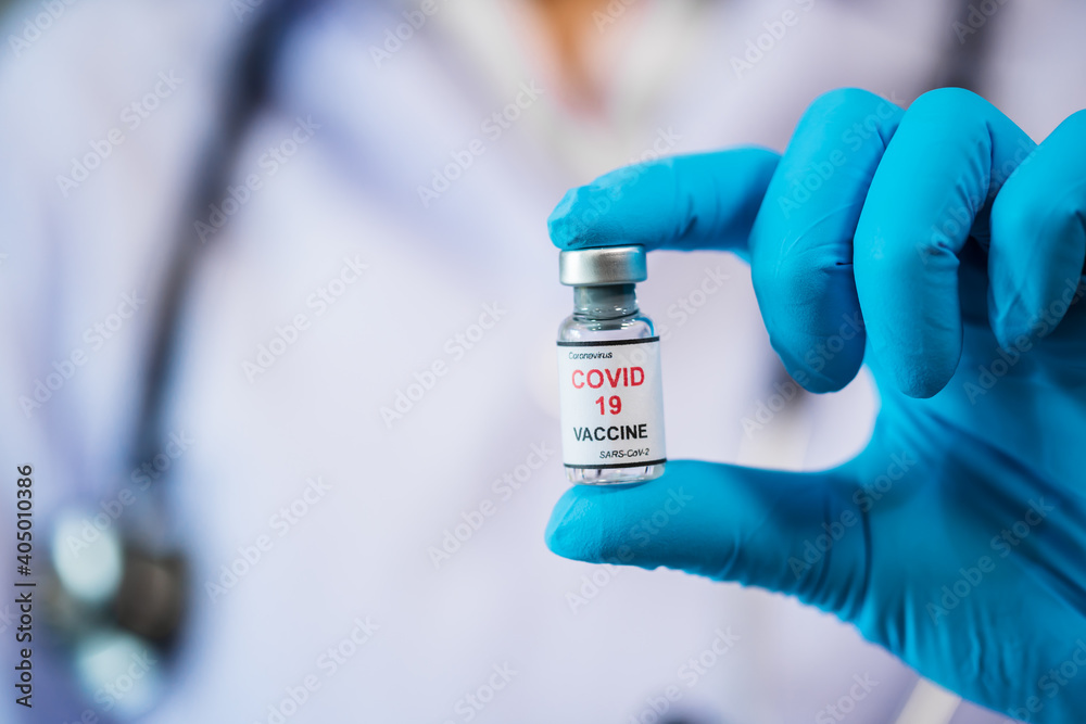doctor holding Coronavirus (Covid-19) vaccine bottle for injection doctor holding Coronavirus (Covid-19) vaccine bottle for injection