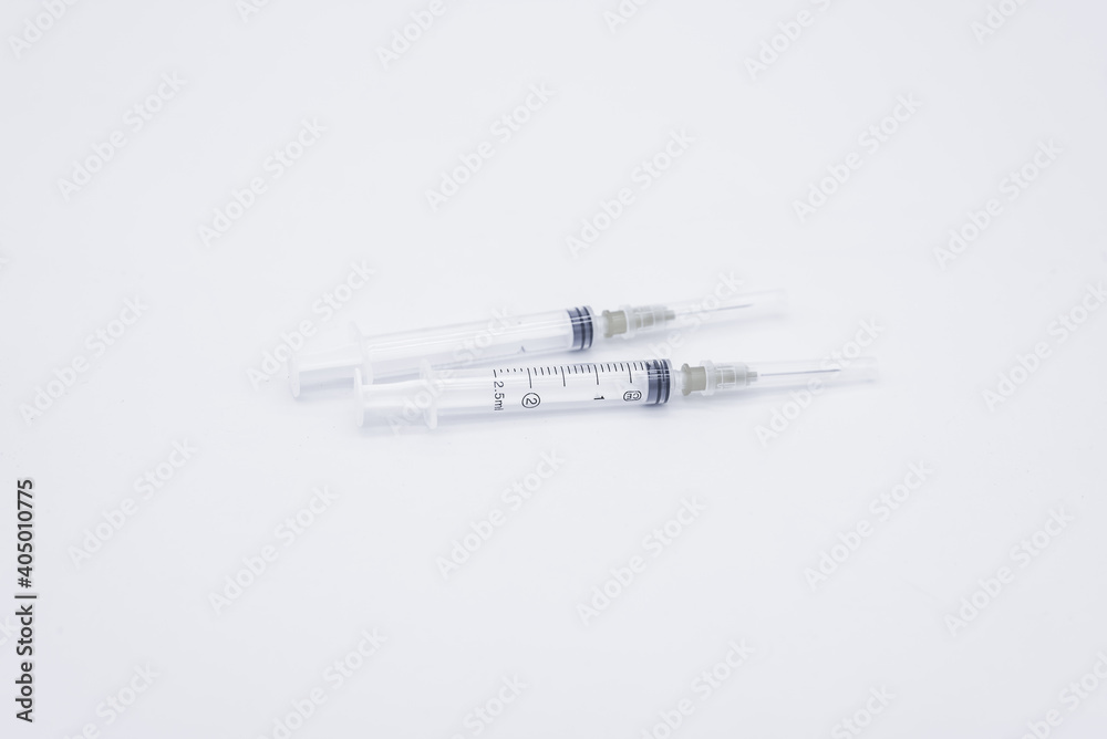 two medical syringes on white background two medical syringes on white background