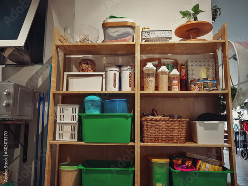 Canvas Print Kuala Lumpur, Malaysia - Sept 10, 2020: Wooden and white kitchen cabinet with food ingredients
