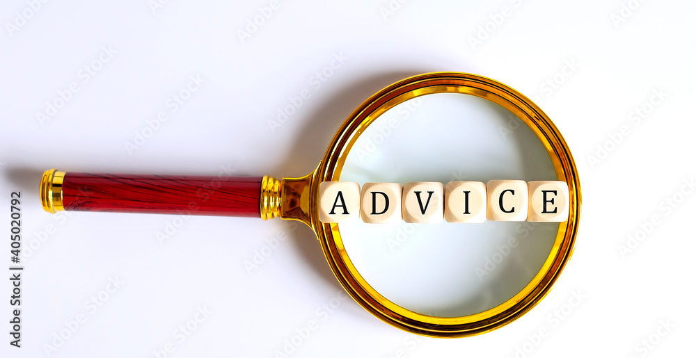 Wooden Blocks with the text: ADVICE on a magnifying glass. Wooden Blocks with the text: ADVICE on a magnifying glass.