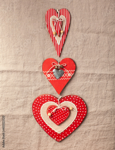 Flatlay hearts on a textile linen tablecloth. Valentine's Day background. 