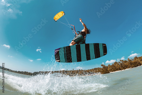 Athlete wakeboarder kite surfer jumps photo