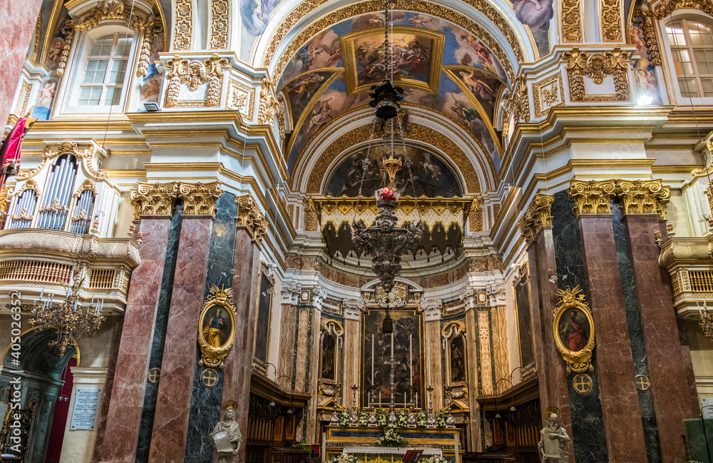 Beautiful interior with paintings and decorations inside of Church in Valletta (or Il-Belt), the capital of the Mediterranean island nation of Malta