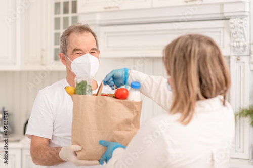 Delivering food to senior man during quarantine Coronavirus (Covid-19) epidemic