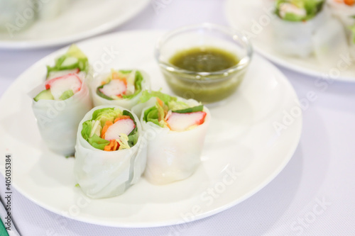 Vermicelli Roll salad with spicy seafood sauce in background