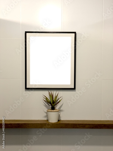 Frame on the wall with isolate on white background © Verachai Jewcharoen