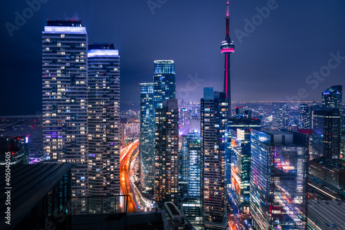 Tall buildings lit at night