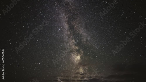 Timelapse of the Milky Way moving through the night sky among clouds