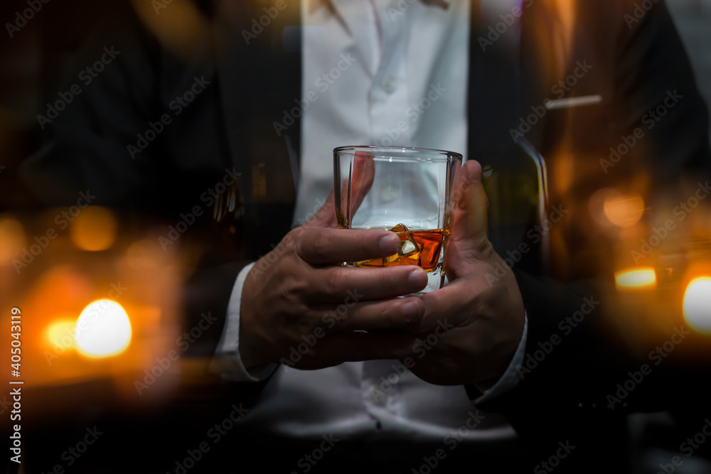 Closeup businessmen holding a glass of whiskey