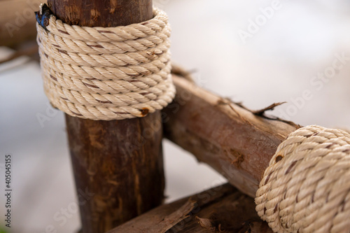 Wooden logs tied with coarse hemp rope