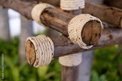 Wooden logs tied with coarse hemp rope