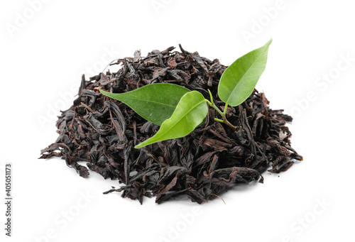 Heap of dry black tea leaves on white background