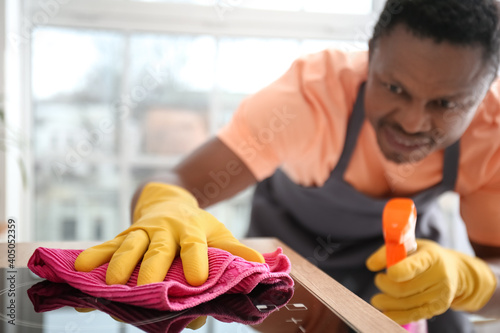 African-American man cleani...