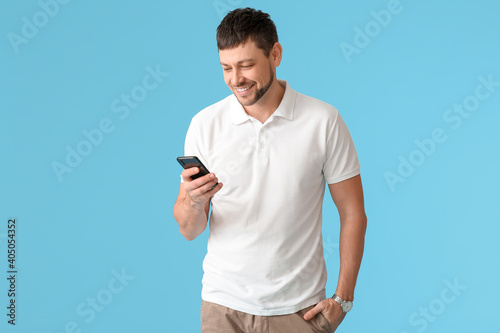 Man with mobile phone on co...