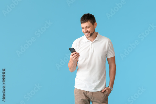 Man with mobile phone on co...