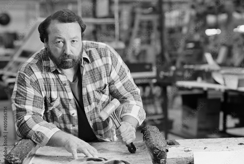 Portrait of blue collar worker in shop Portrait of blue collar worker in shop