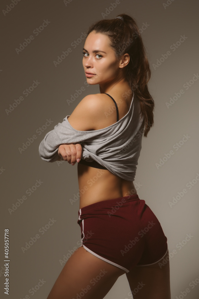 Obraz premium Sexy sports girl in a fashion photo shoot