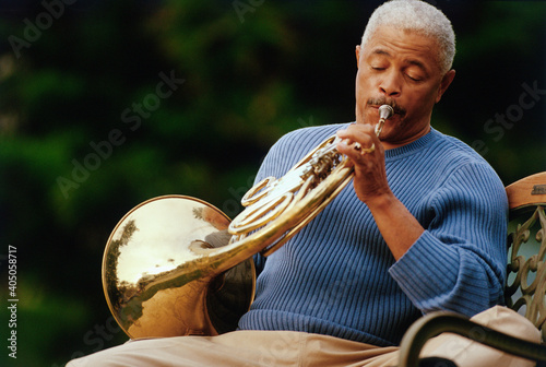 Man playing French horn photo