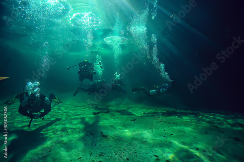 underwater world cave of yucatan cenote, dark landscape of stalactites underground, diver © kichigin19