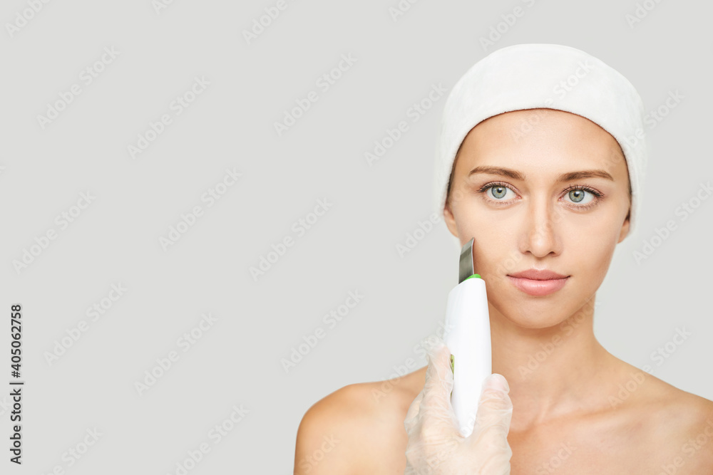 Ultrasonic skin equipment. Woman face cosmetology treatment. Female clinic facial procedure. Anti acne surgery cleaning. Dermatology spa mask. Detox therapy. Rejuvenation skincare beauty. Copyspace Ultrasonic skin equipment. Woman face cosmetology treatment. Female clinic facial procedure. Anti acne surgery cleaning. Dermatology spa mask. Detox therapy. Rejuvenation skincare beauty. Copyspace
