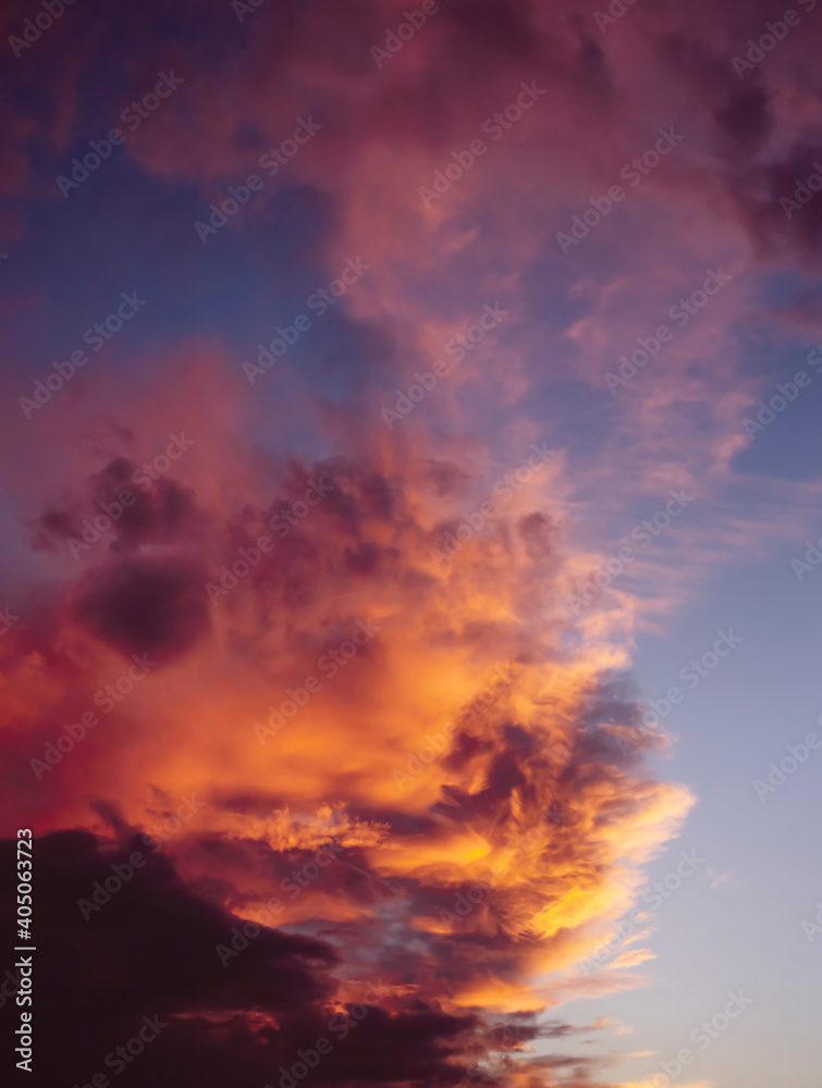 Dramatic orange and purple clouds in the sky as the sun goes down Dramatic orange and purple clouds in the sky as the sun goes down