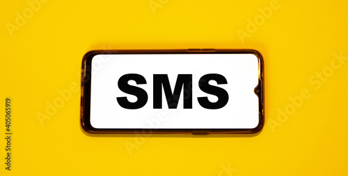 SMS message received on the smartphone screen. Innovation on an orange background.
