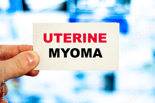 Doctor holding a paper with a female diagnosis of Uterine myoma photo