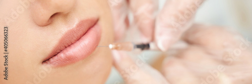 Lip injection at spa salon. Doctor hands. Closeup view. Pretty female patient. Beauty treatment. Healthy skin procedure. Young woman lifting. Facial treatment. Dermatology detox therapy. Rejuvenation