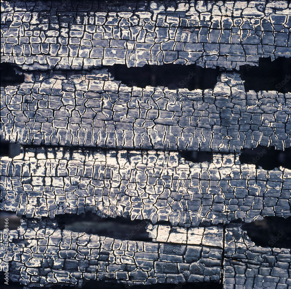Close up of burnt and charcoaled planks of wood