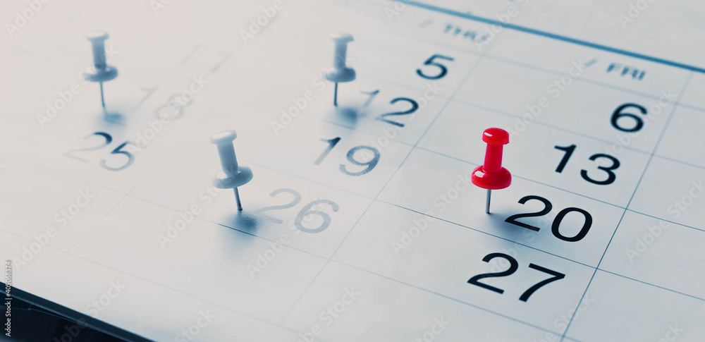 Calendar page pinned in a calender on datebusiness meeting schedule, travel planning or project milestone and reminder concept. Calendar page pinned in a calender on datebusiness meeting schedule, travel planning or project milestone and reminder concept.