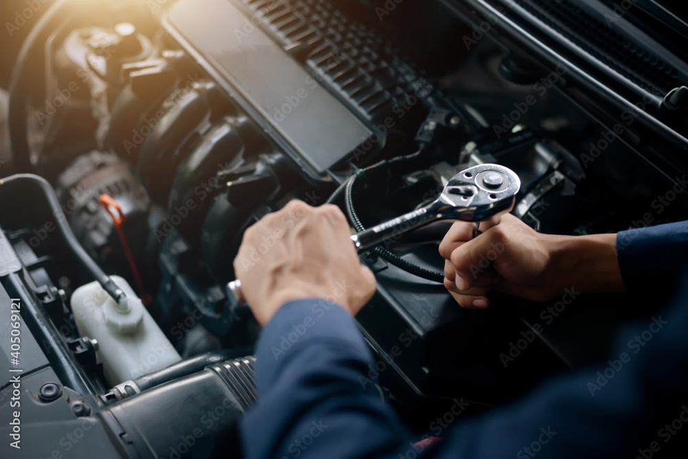 Car service, repair, maintenance concept. Auto mechanic working in garage. Car service, repair, maintenance concept. Auto mechanic working in garage.