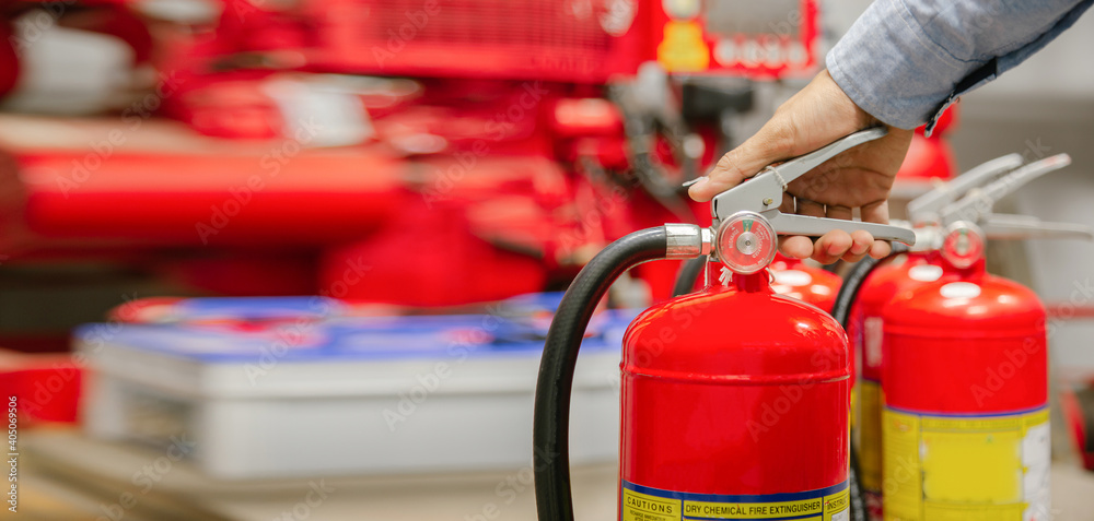 Engineer inspection Fire extinguisher and fire hose,Ready to use in the event of a fire.Safety first concept.