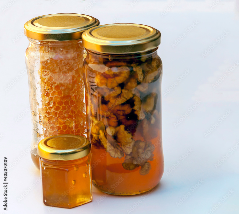 Honey with nuts surrounded by white background Honey with nuts surrounded by white background