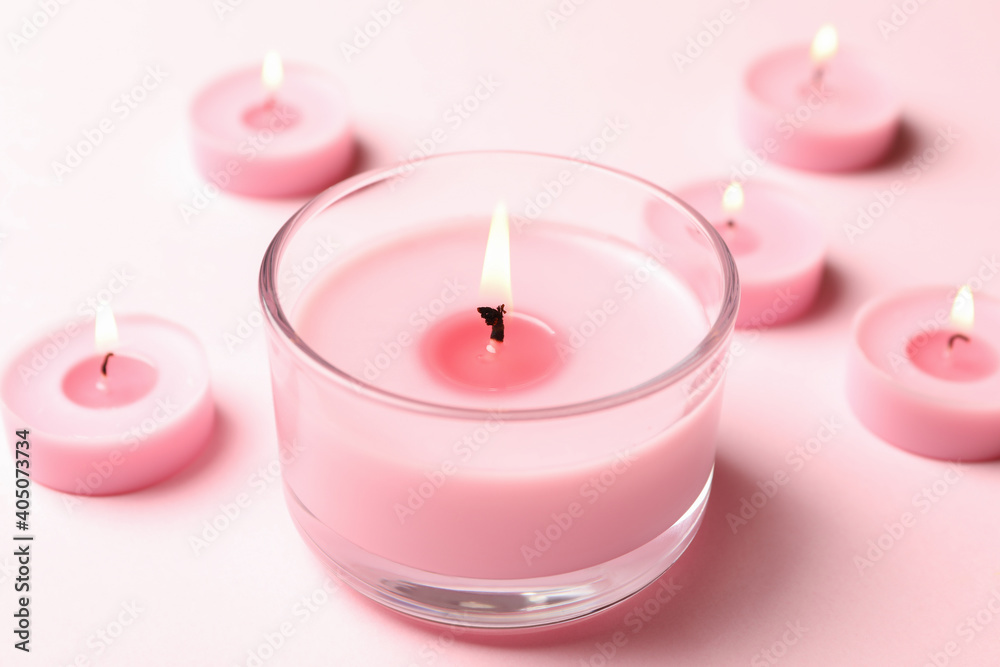 Scented candles for relax on pink background Scented candles for relax on pink background